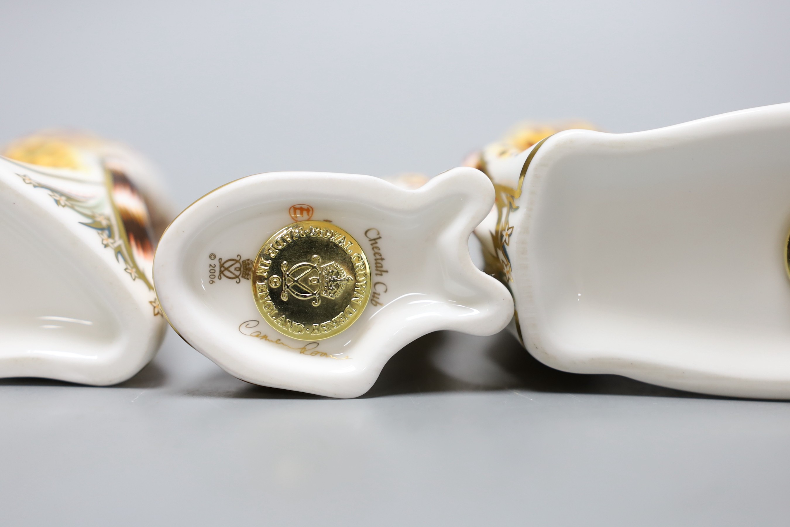 Three Royal Crown Derby paperweights - Cheetah, gold stopper, boxed with certificate, Cheetah Daddy, gold stopper, boxed with certificate and Cheetah Cub, gold stopper, boxed with certificate